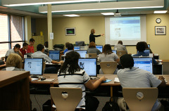 Photograph of a librarian teaching a class in the library