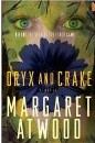 Book cover of Oryx and Crake shows a blueish flower hiding the mouth of a pale woman. Leaves also are around her face.