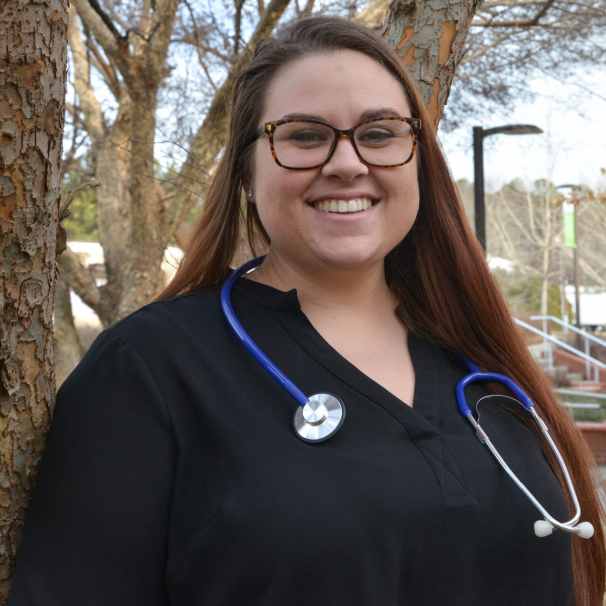 headshot of Chelsea on main campus with stethescope around neck