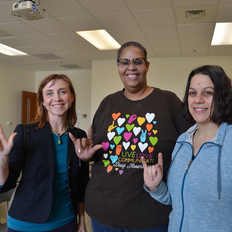 Crystal Honeycutt Willock, Buffi-Lynn Gaskin-Fisher, Claudia Rayno sign I Love You 