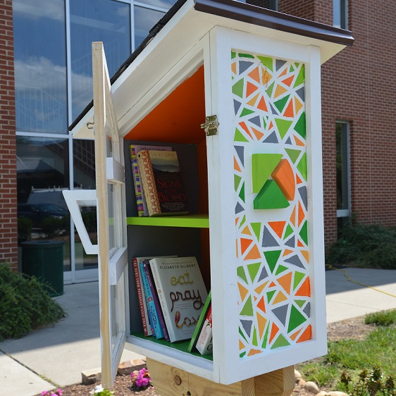 photo of little library on main campus in front of Wynn Building
