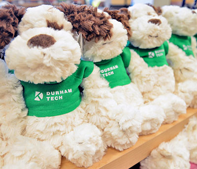 plush dogs wearing Durham Tech t-shirts