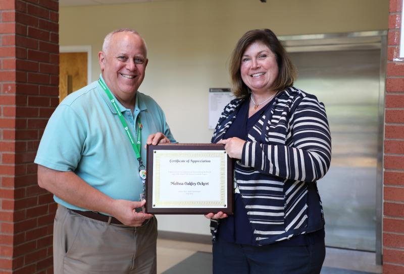 bill gluck, melissa oakley ockert with certificate of appreciation 