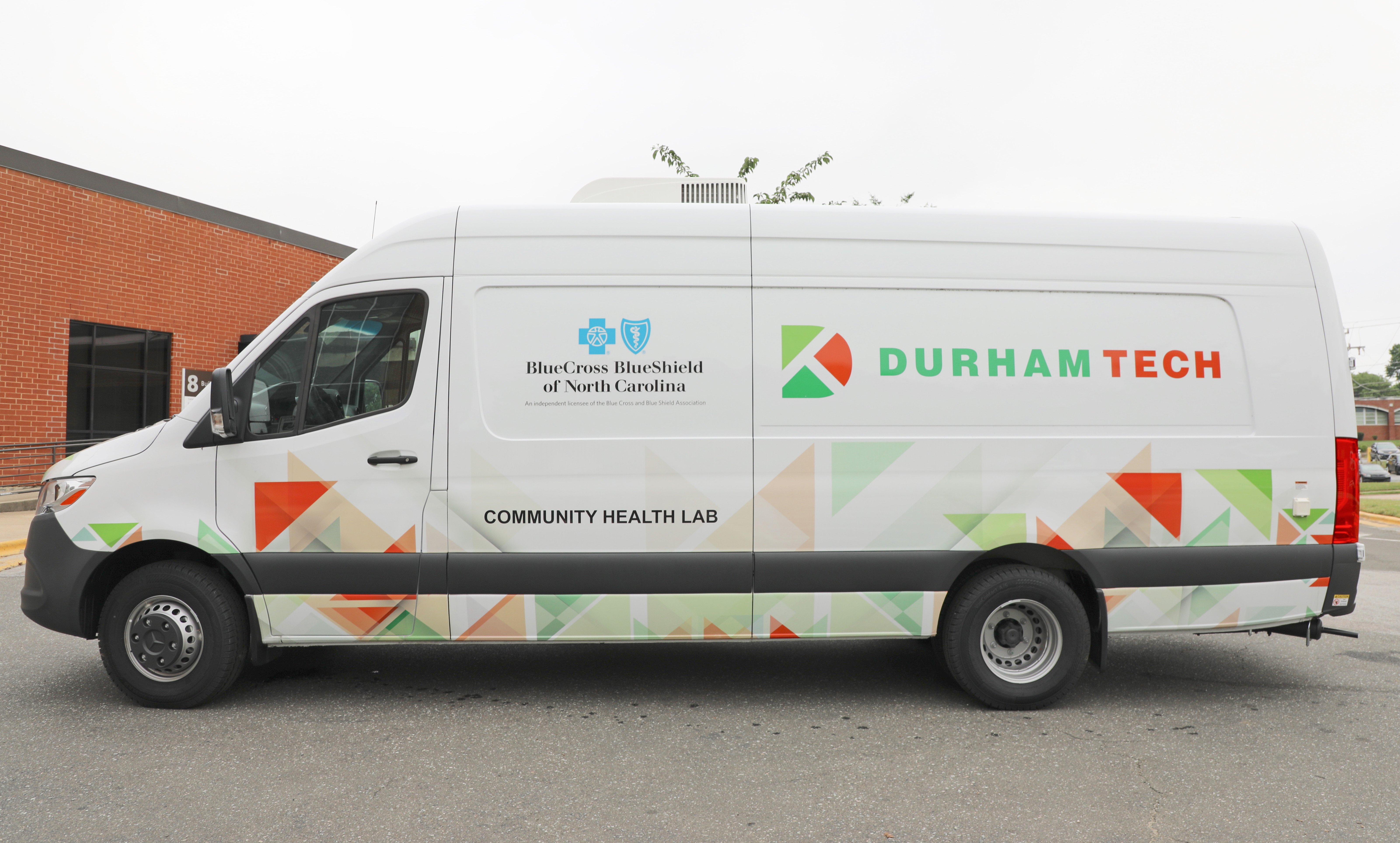 white van with durham tech logo and blue cross blue shield logo