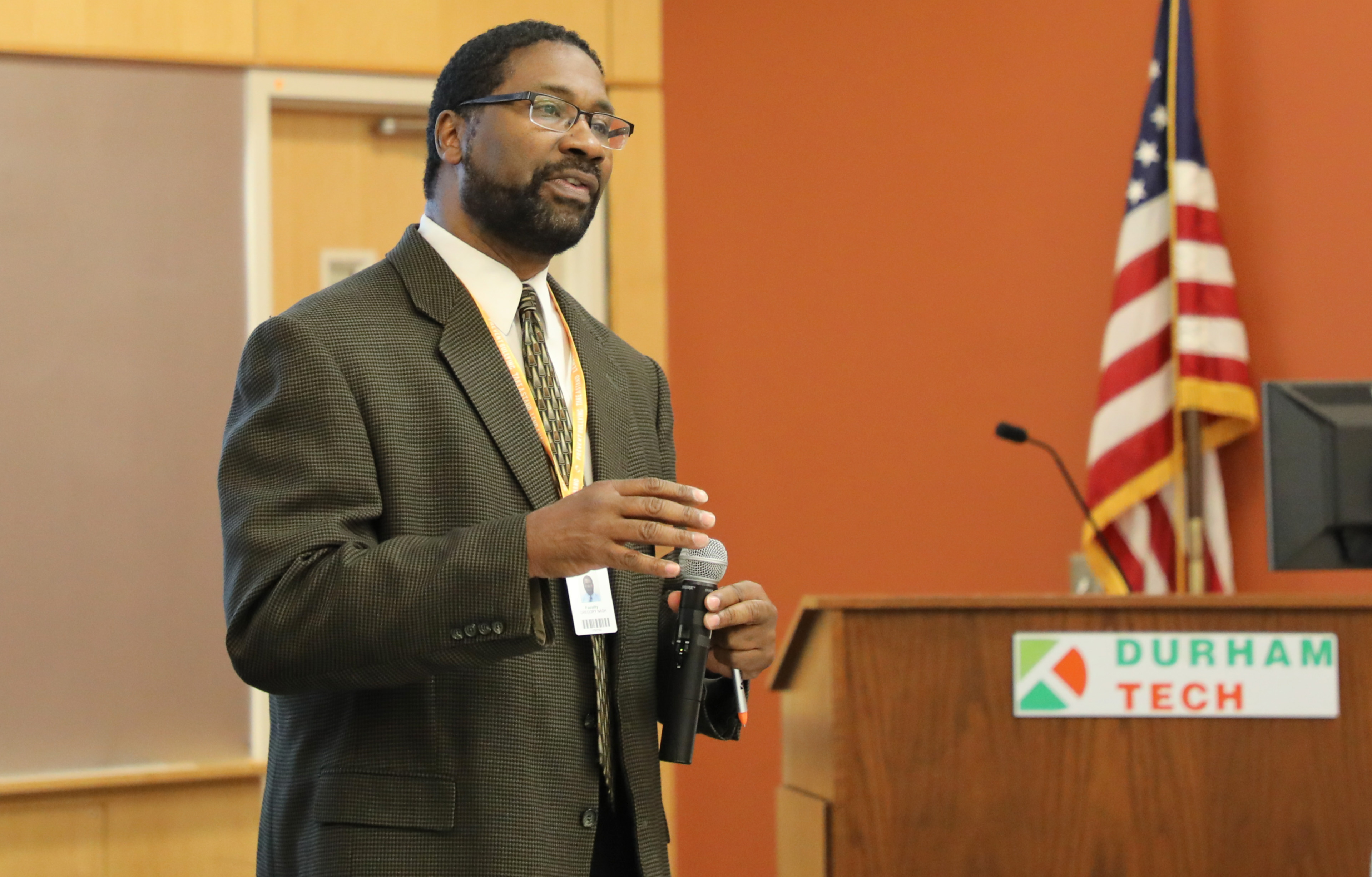 man holding microphone and speaking