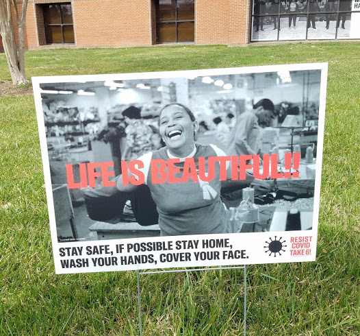 photo of yard sign on main campus that says life is beautiful