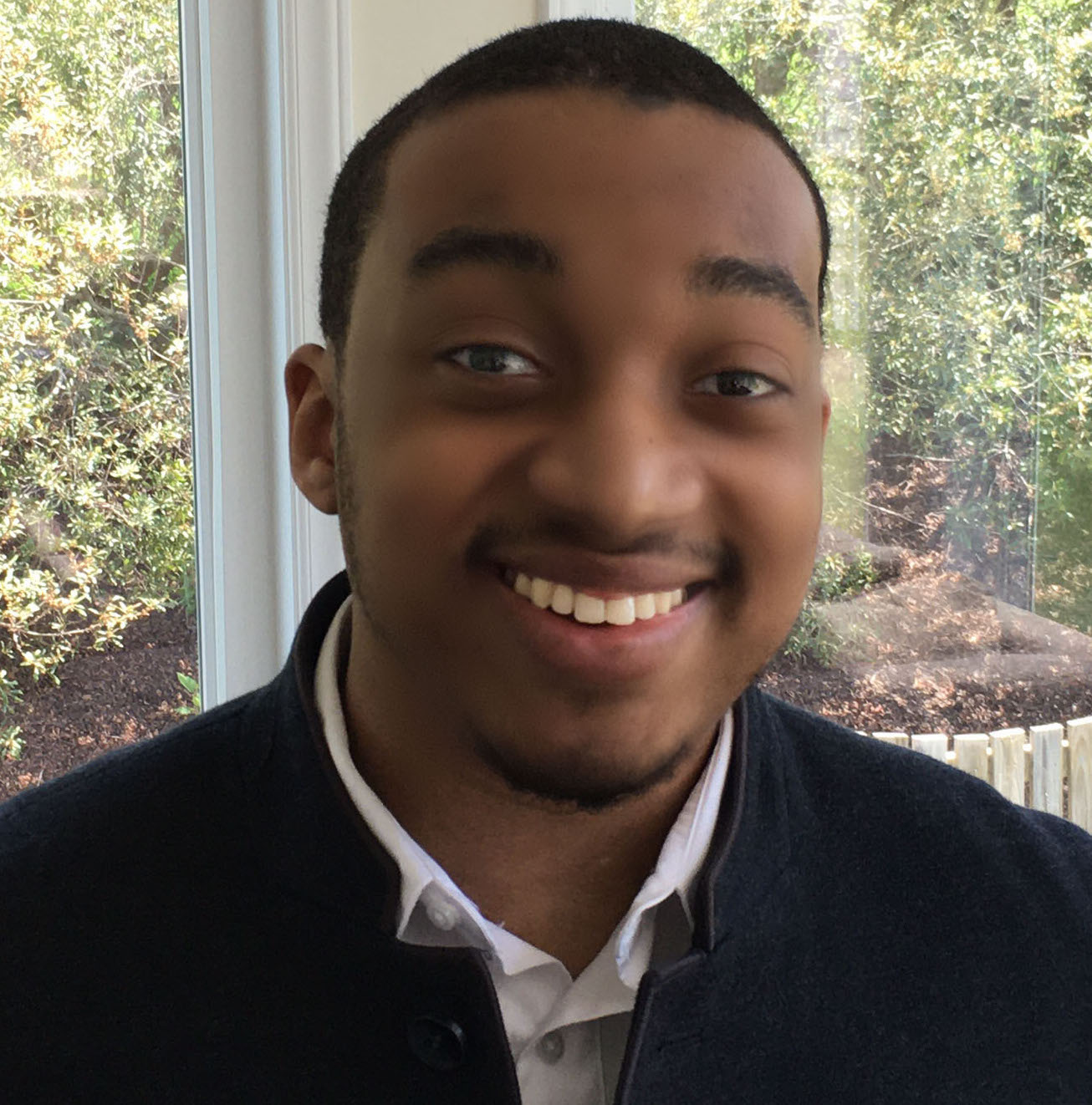 headshot of leon bradford smiling