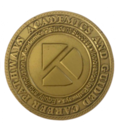 close up of coin with durham tech logo on it