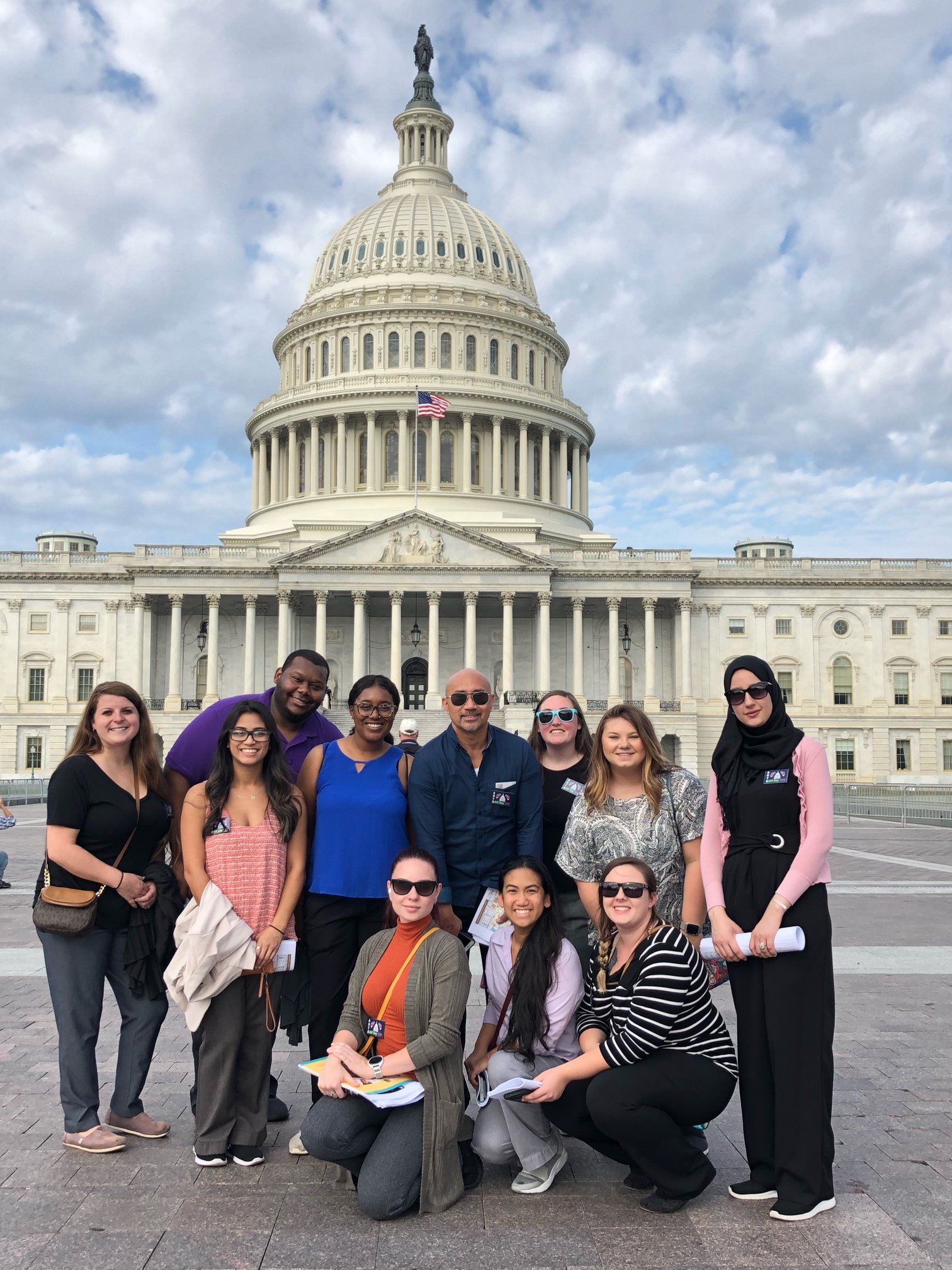 group of people in front of US Capitol