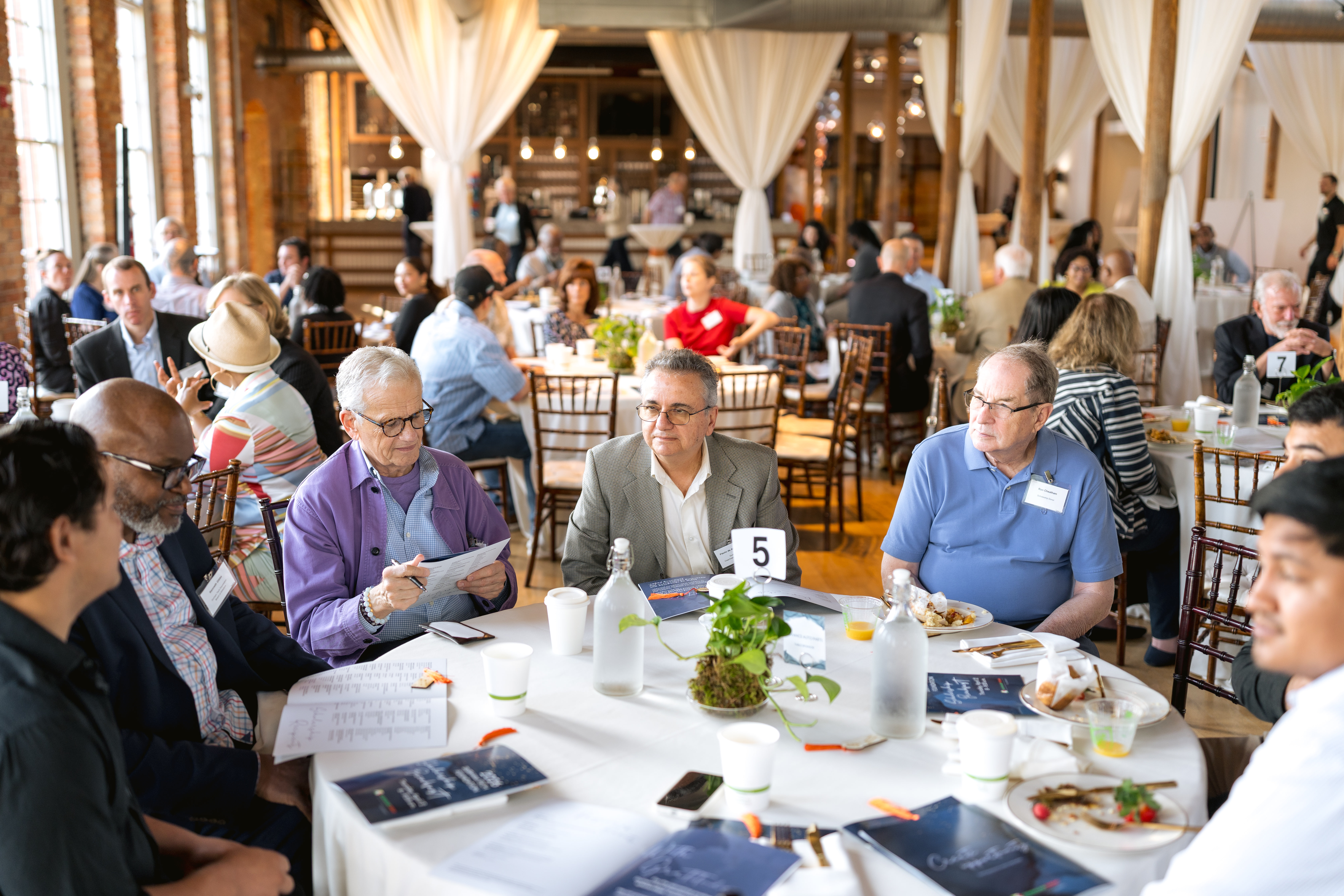 Attendees enjoy visiting at the Scholarship Breakfast