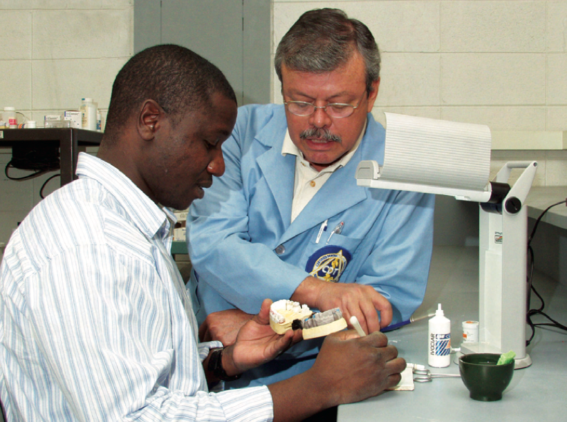 two people using dental equipment