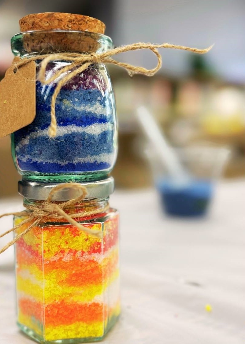 tiny colorful candles stacked on top of eachother