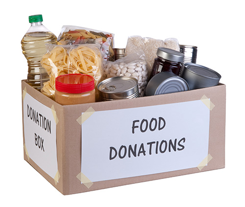 a cardboard box of canned and shelf-stable foods