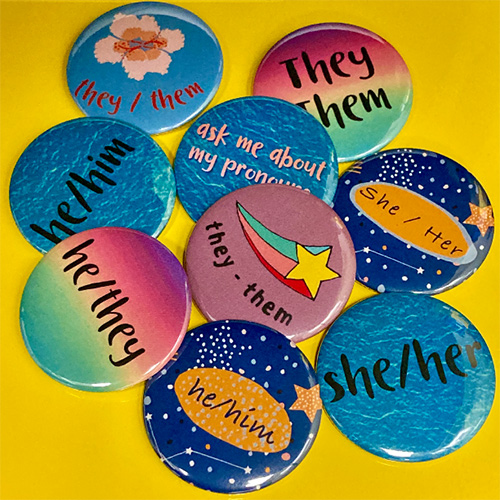 buttons with he, she, or they on them