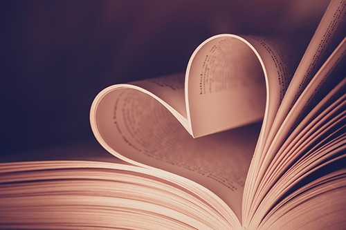 pages of a book folded into a heart shape