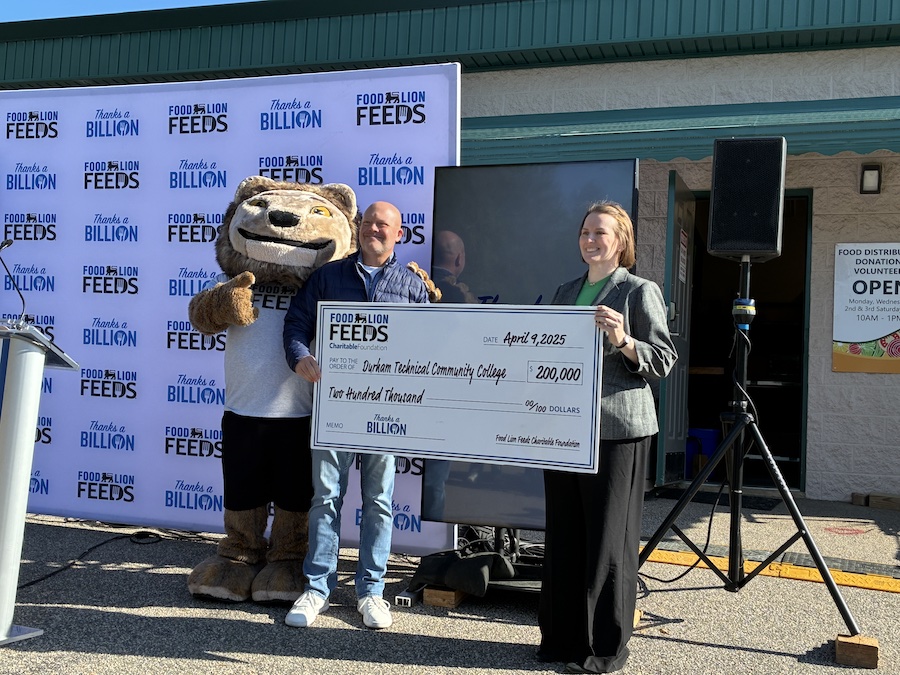 Food Lion Feeds presents the check to Durham Tech.