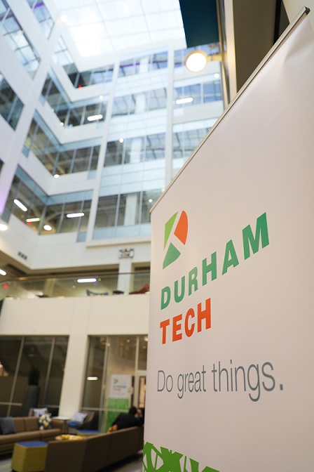 durham tech pop up banner in atrium of new building, looking upward