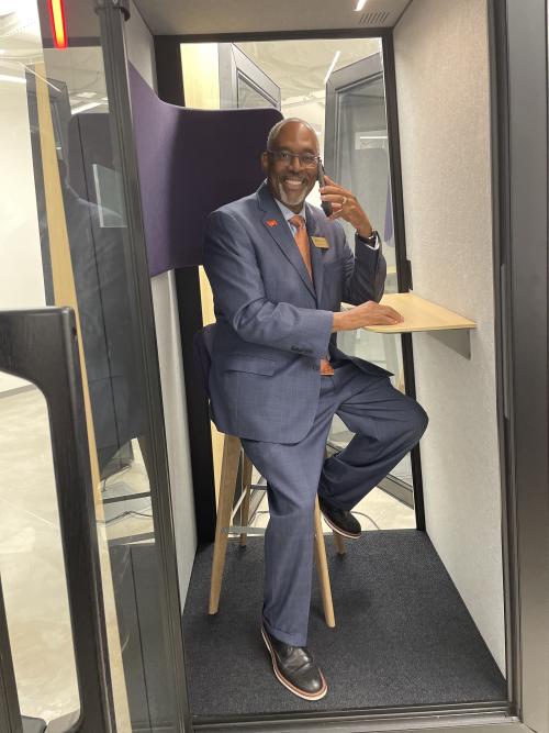 Durham Tech's Jerry Jones tests out one of the phone booths at the Innovation Carolina Junction.