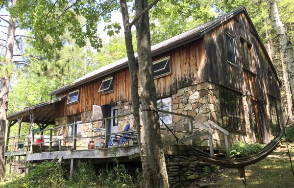 photo of a house in woods