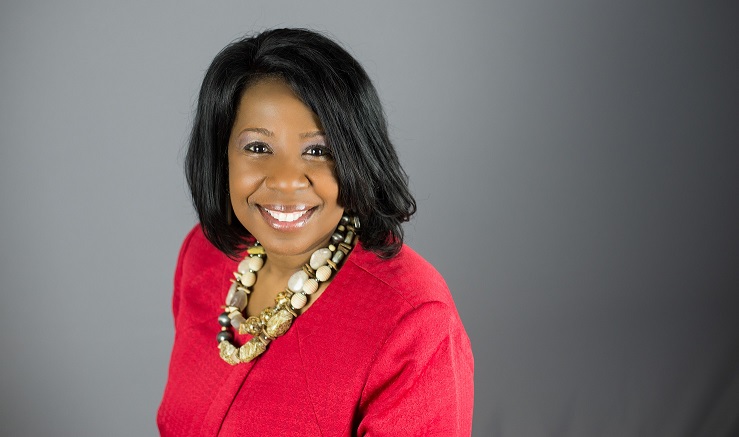 headshot of Gracie Lopez Johnson with grey background