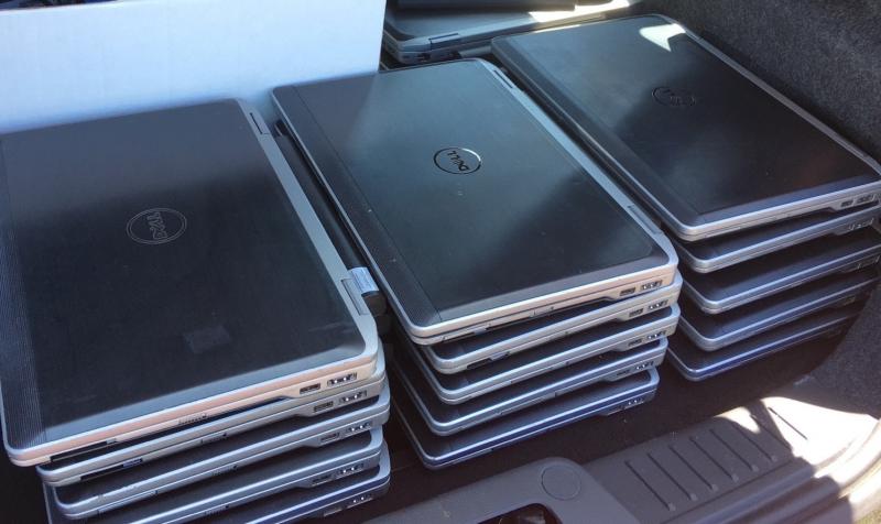 pile of laptops in back of car