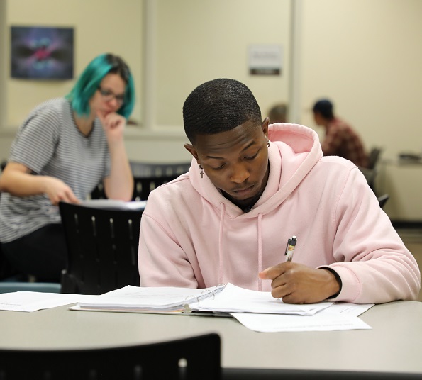 two students studying at difference desks