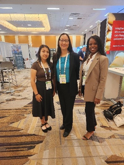 Dr. Traynor with Durham Tech graduates Adriana Delgado (left) and Carmine Johnson (right) at the 2024 Association of Clinical Research Professionals Conference.