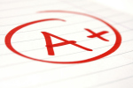 Photo of a red grade, "A+", circled on a paper