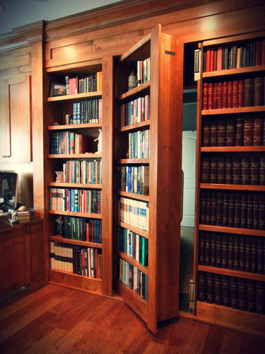 Secret door hidden behind library books... to remind you to get the password by completing the Durham Tech Daily Check-In form linked in the text.
