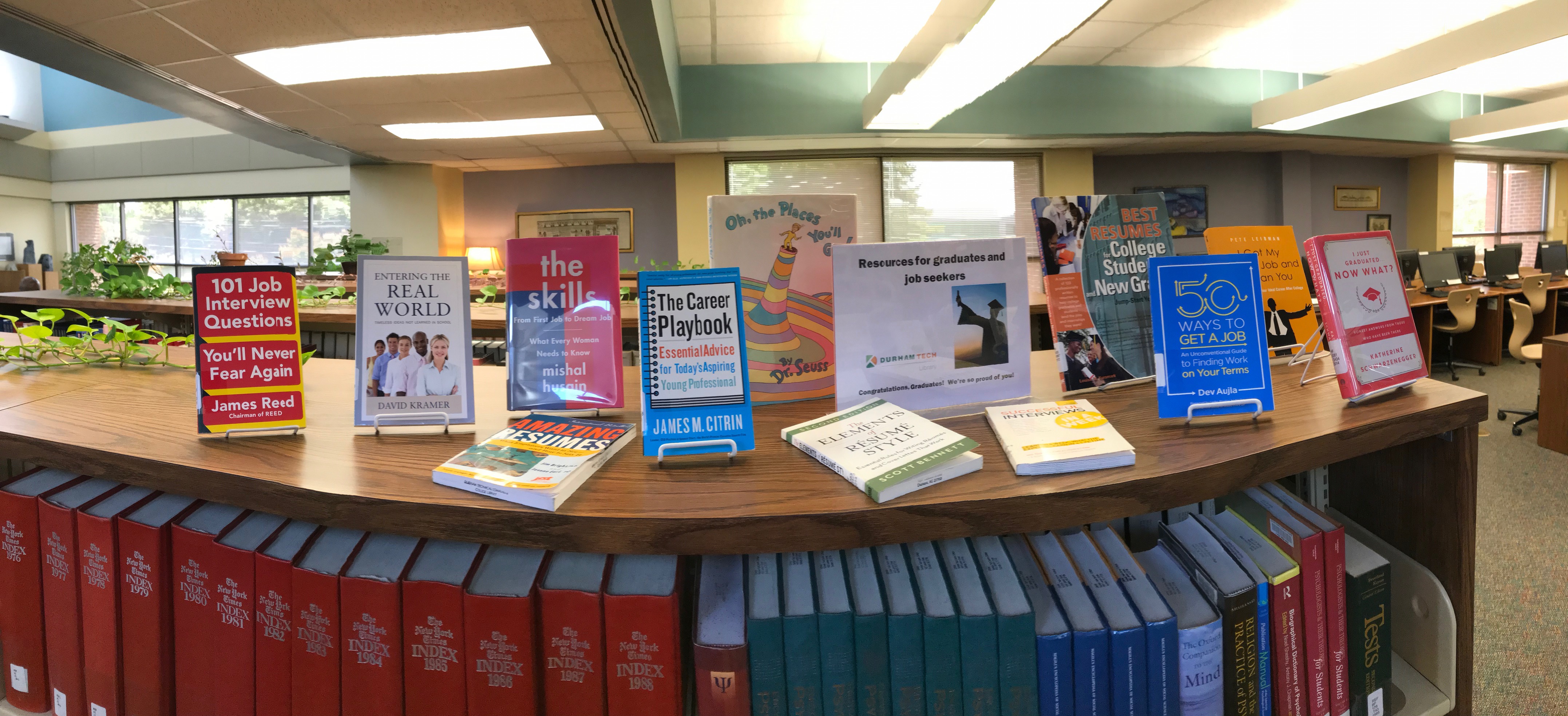 The Main Campus Library display of resources for graduates and job seekers, including 101 Job Interview Questions You'll Never Fear Again by James Reed, Entering the Real World by David Kramer, The Skills: From First Job to Dream Job, What Every Woman Needs to Know by Mishal Husain, Amazing Resumes, The Career Playbook: Essential Advice for Today's Aspiring Young Professional by James M. Citrin, Oh The Places You'll Go by Dr. Seuss, The Elements of Resume Style by Scott Bennett, Successful Interviews in a …