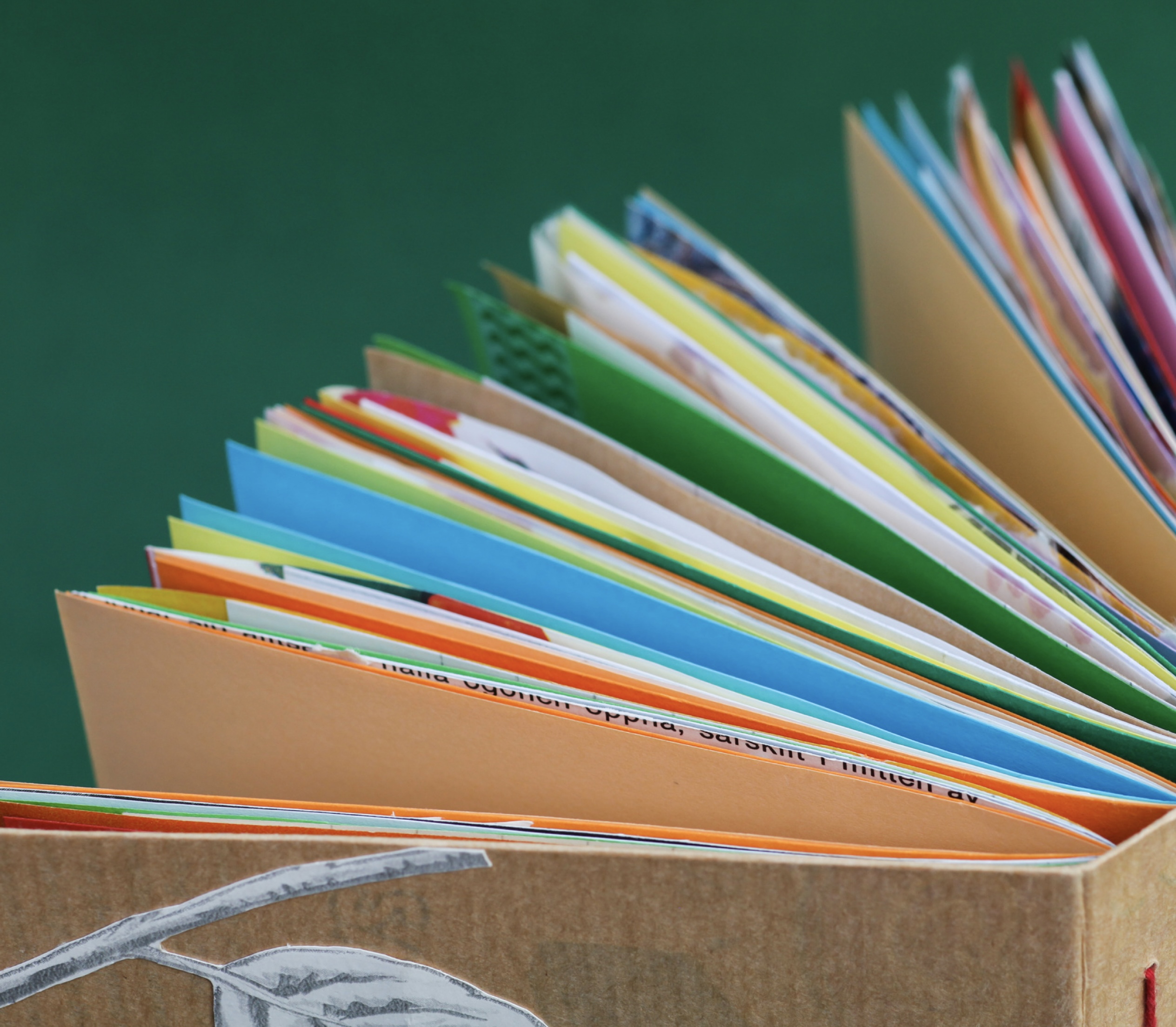 hand-bound multi-colored book pages