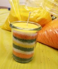 granulated wax candle in yellow, orange, and green