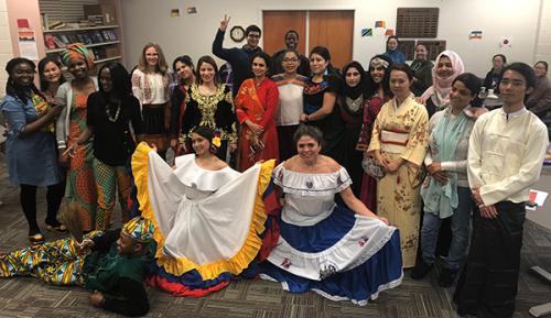 a group of non-US students dress in native costumes