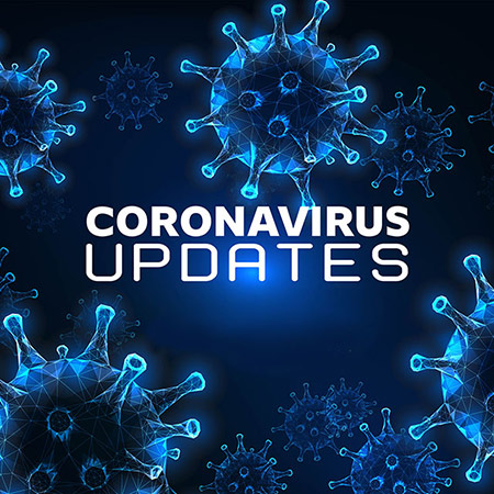 Corona Virus Updates headline depicted on background of magnified virus cells
