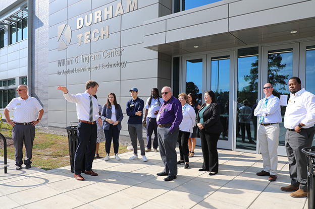 President Buxton shows people the new Ingram Building
