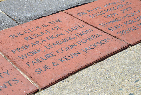 brick enscribed with a quote