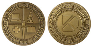 front of challenge coin shows the college seal with the college opening year 1961 and the D logo icon with the name of the award