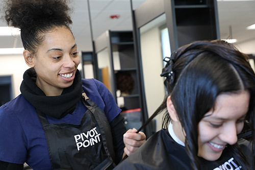 student cuts provides a haircut at hair care clinic
