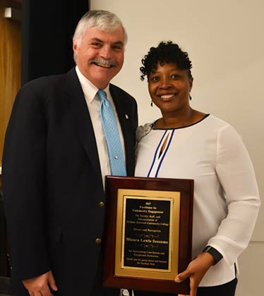 Micara poses with President Ingram