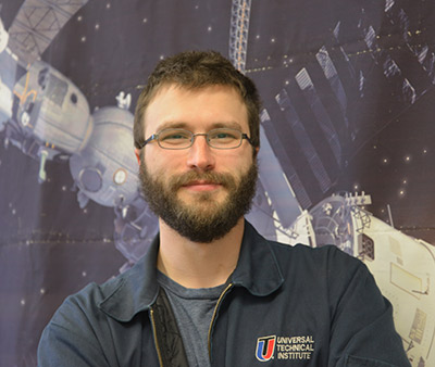 Daniel Koris with an image of a space capsule in the background