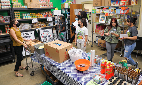 a small group of students visit the food pantry 