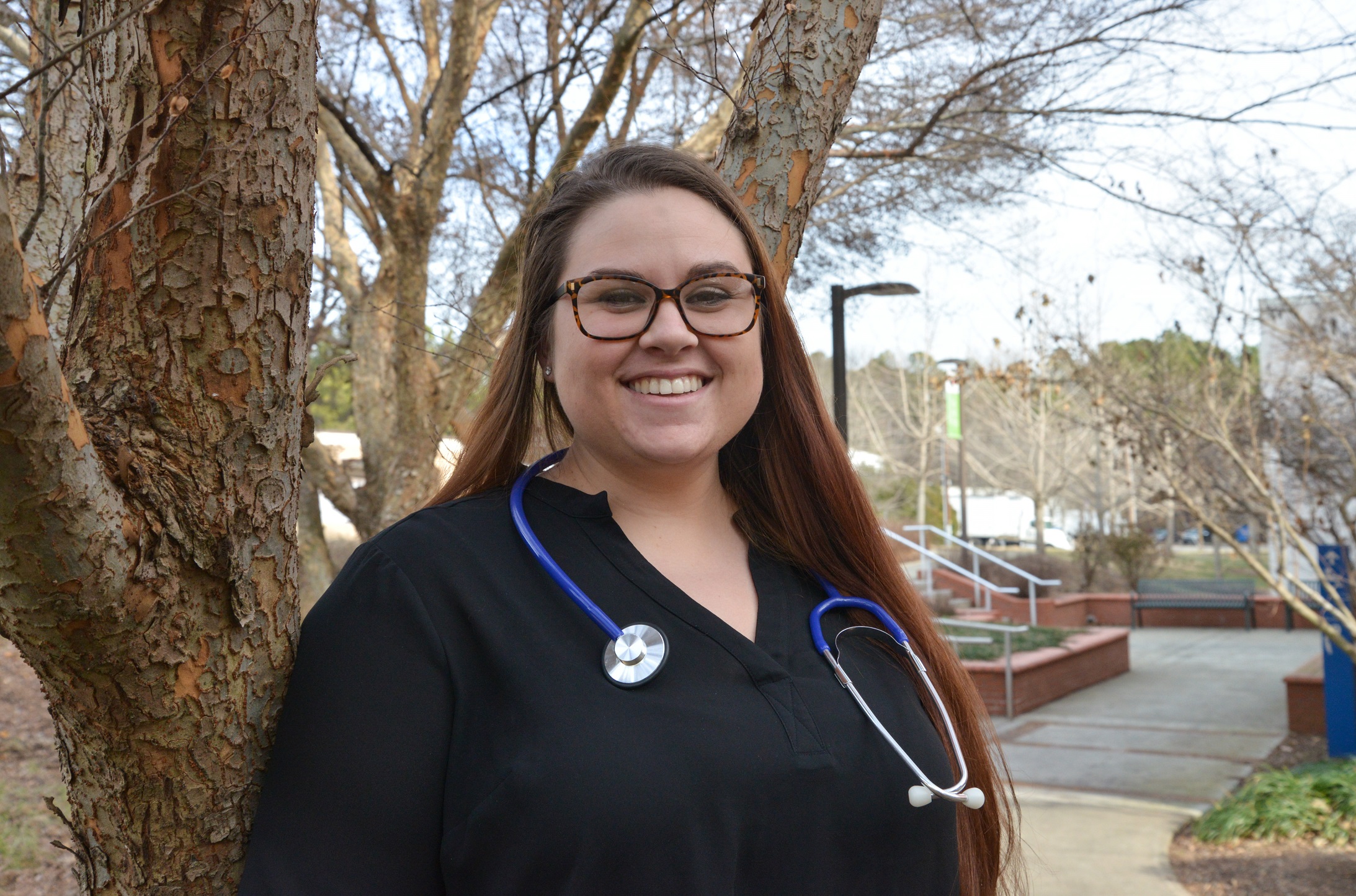 headshot of Chelsea on main campus with stethescope around neck