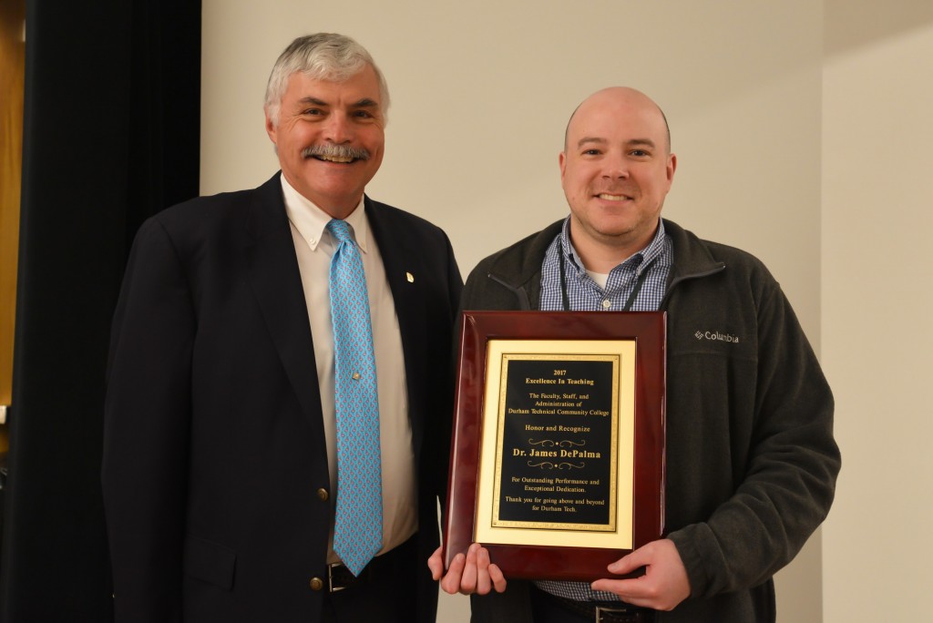 President Ingram and Jim DePalma, holding award