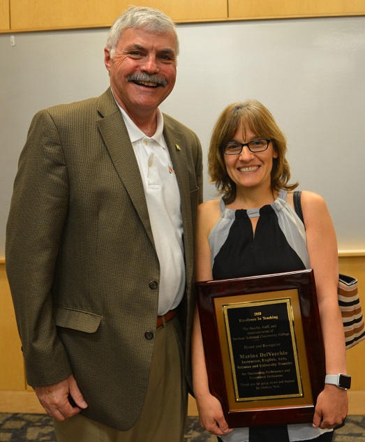 President Ingram and Marina DelVecchio, holding plaque