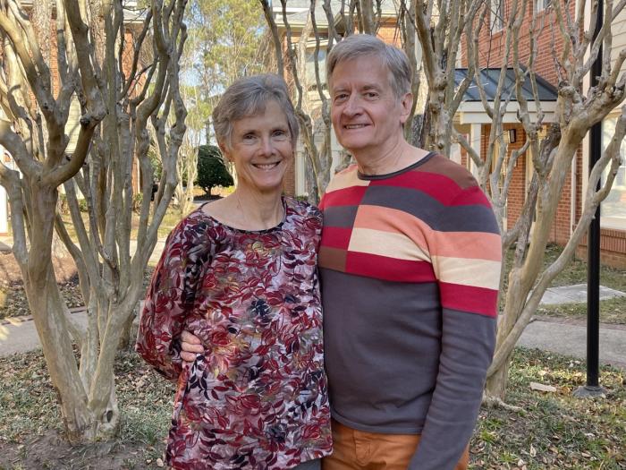 two people smiling at camera