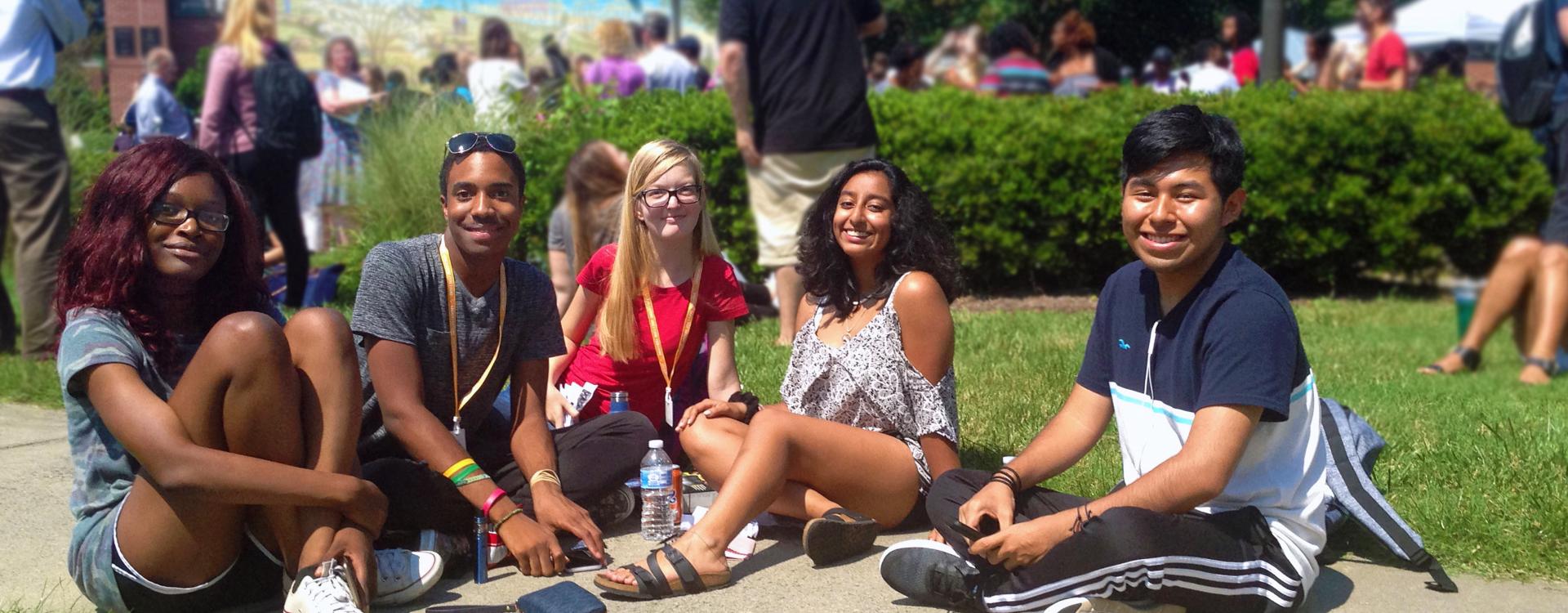 A group of Durham Tech students hang out in the plaza on campus.