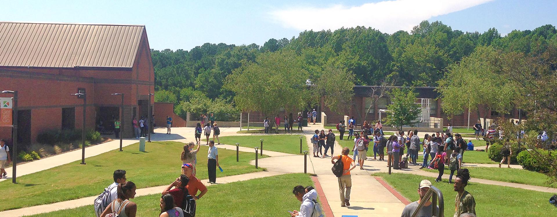 students walking in campus quad