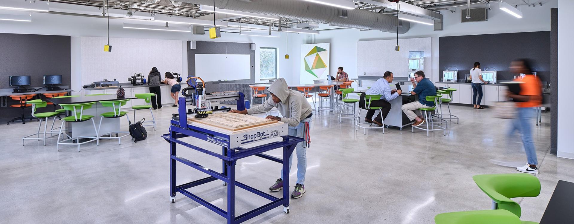 Students in the Newton Makerspace using the computers and equipment to explore their creative interests