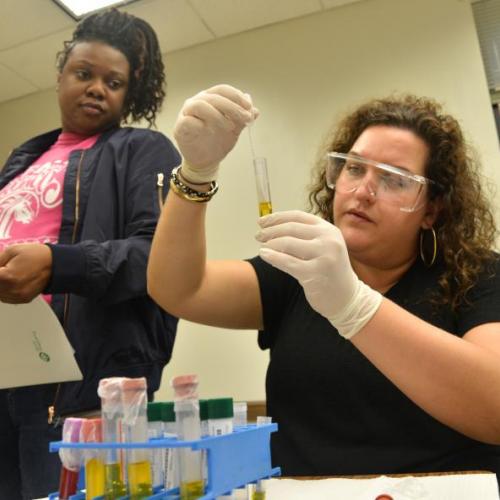 two female students study tube 