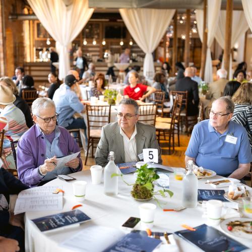 Attendees enjoy visiting at the Scholarship Breakfast